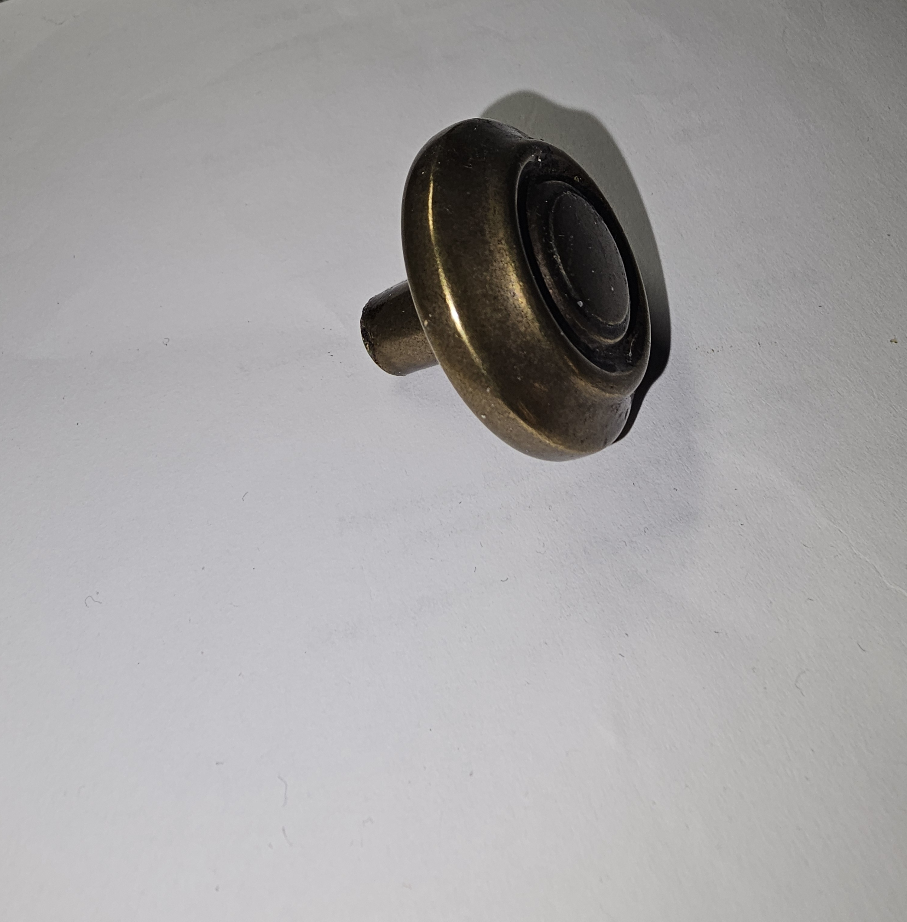 Vintage brass bullseye/mushroom-top cabinet knob-side